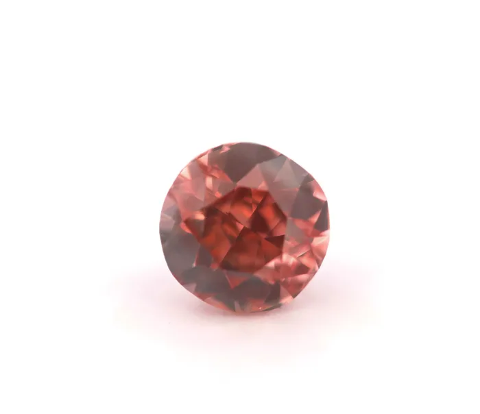 fancy orangy pink round diamond