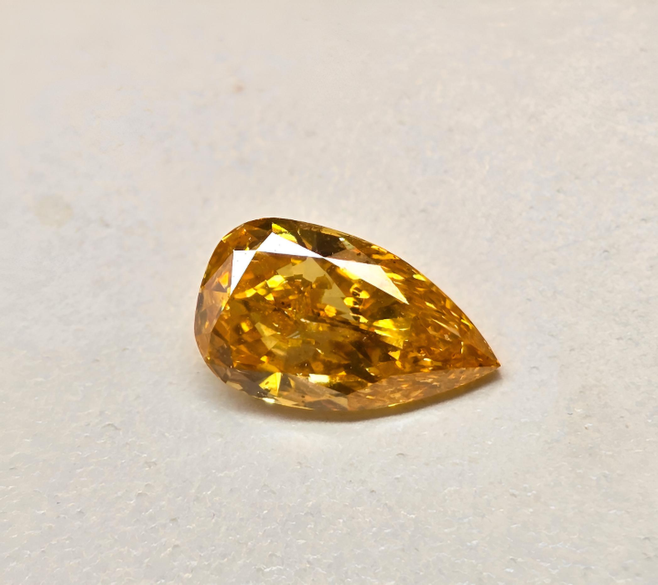 1.03 carat Carat Pear Modified Brilliant Fancy Vivid Yellow-Orange I1 GIA Certified Diamond