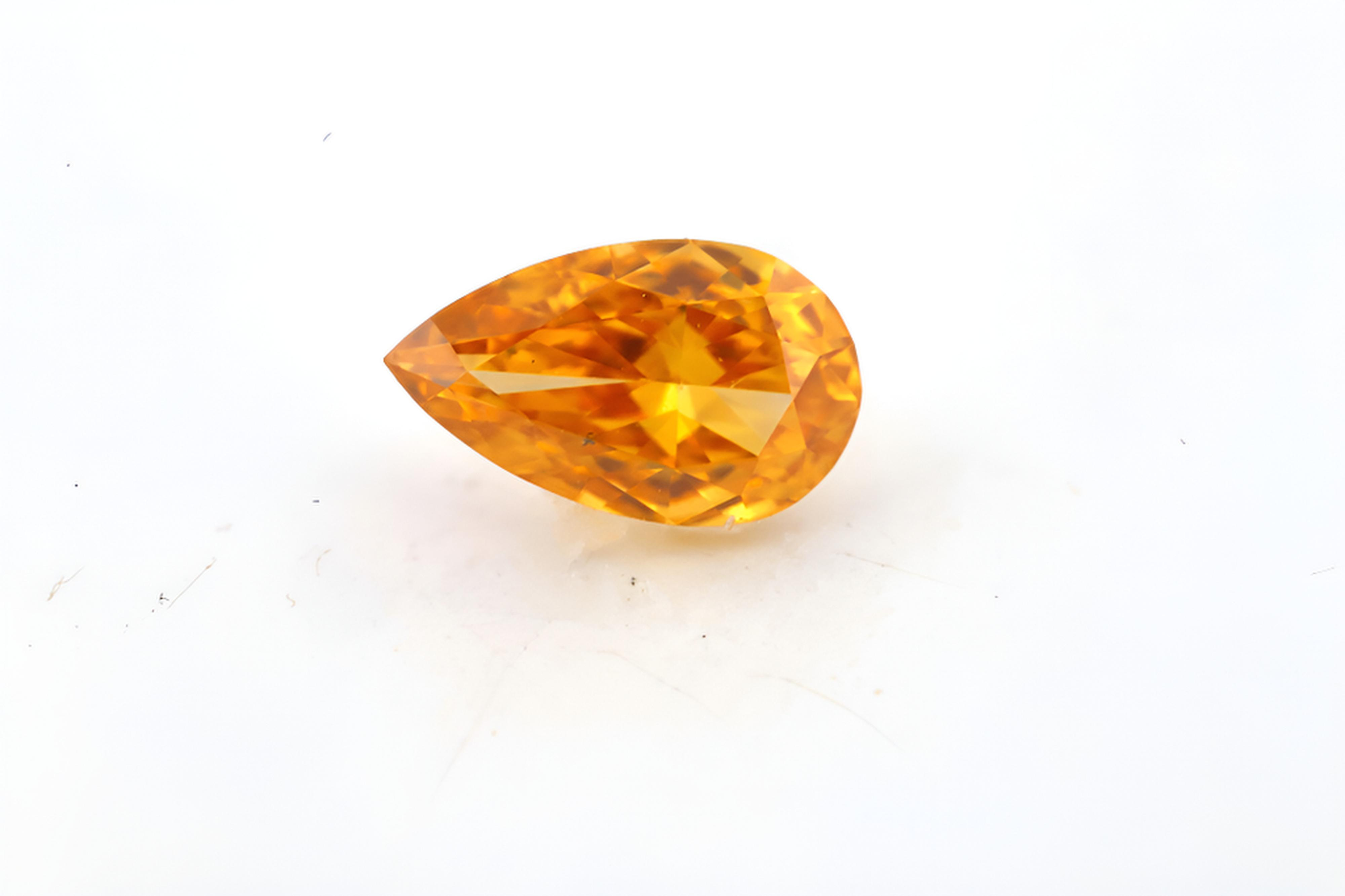 0.25 carat Carat Pear Modified Brilliant Fancy Vivid Yellow-Orange VS2 GIA Certified Diamond