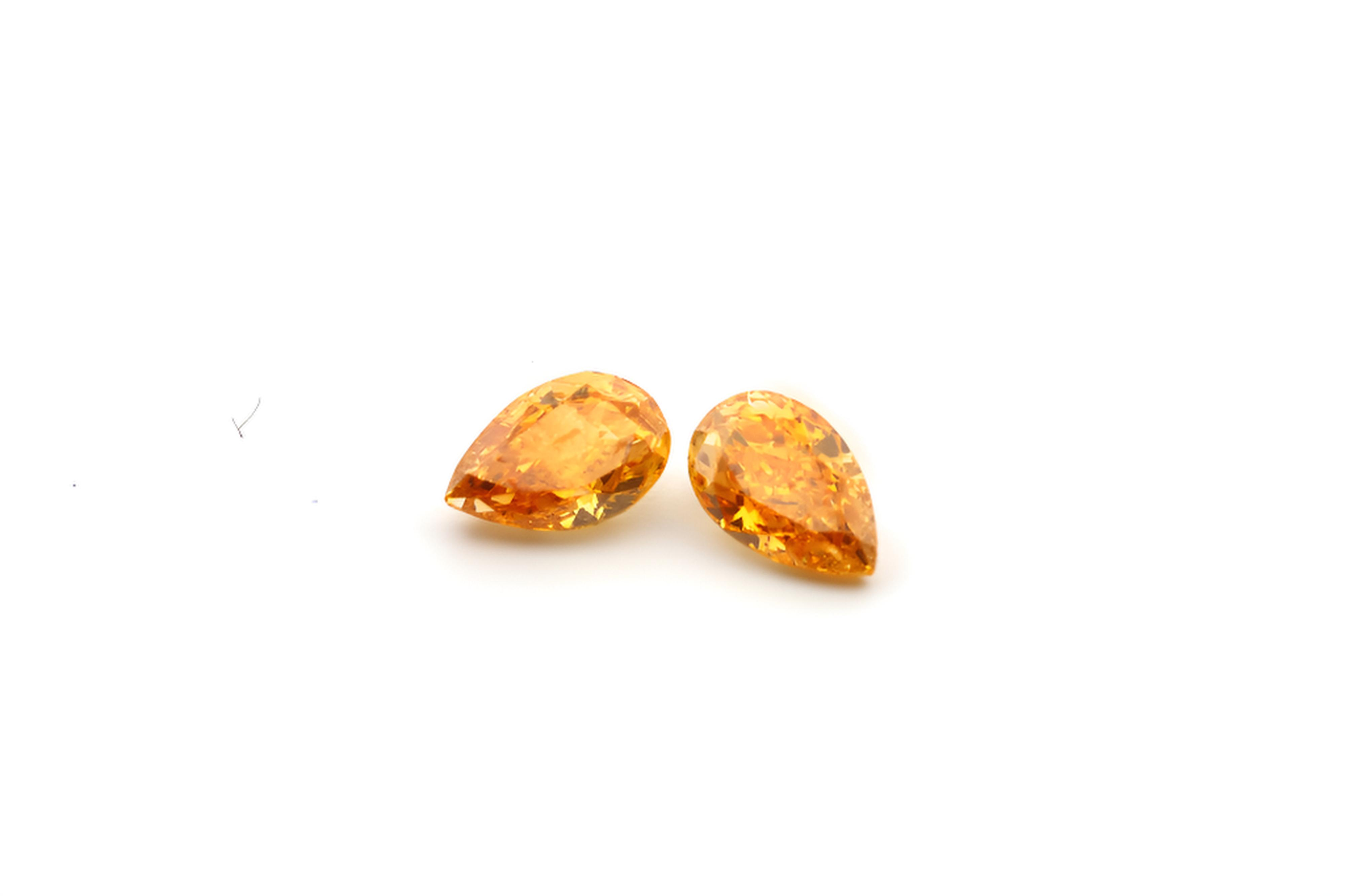 0.45ct matching pair Vivd orange diamonds pear shape GIA