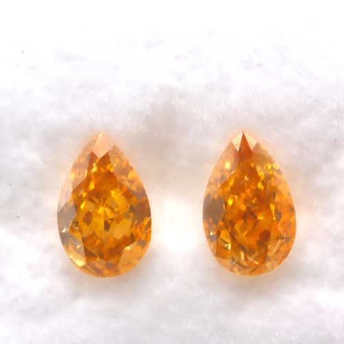 0.45ct matching pair Vivd orange diamonds pear shape GIA